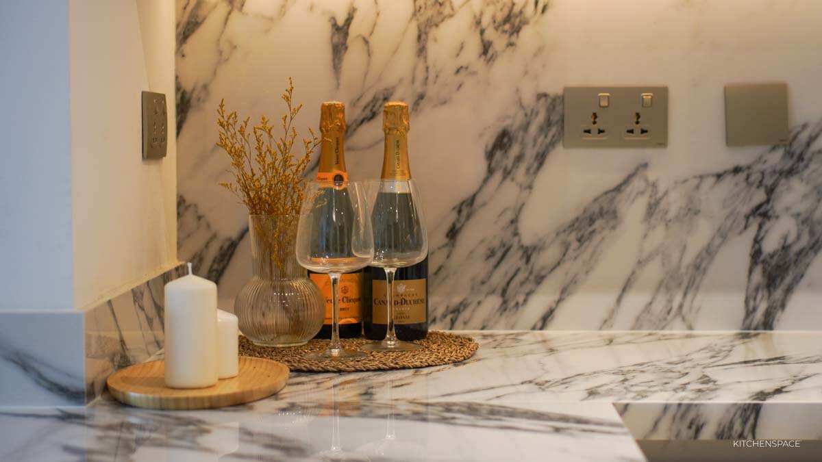 Open-Concept Marble Waterfall Kitchen
